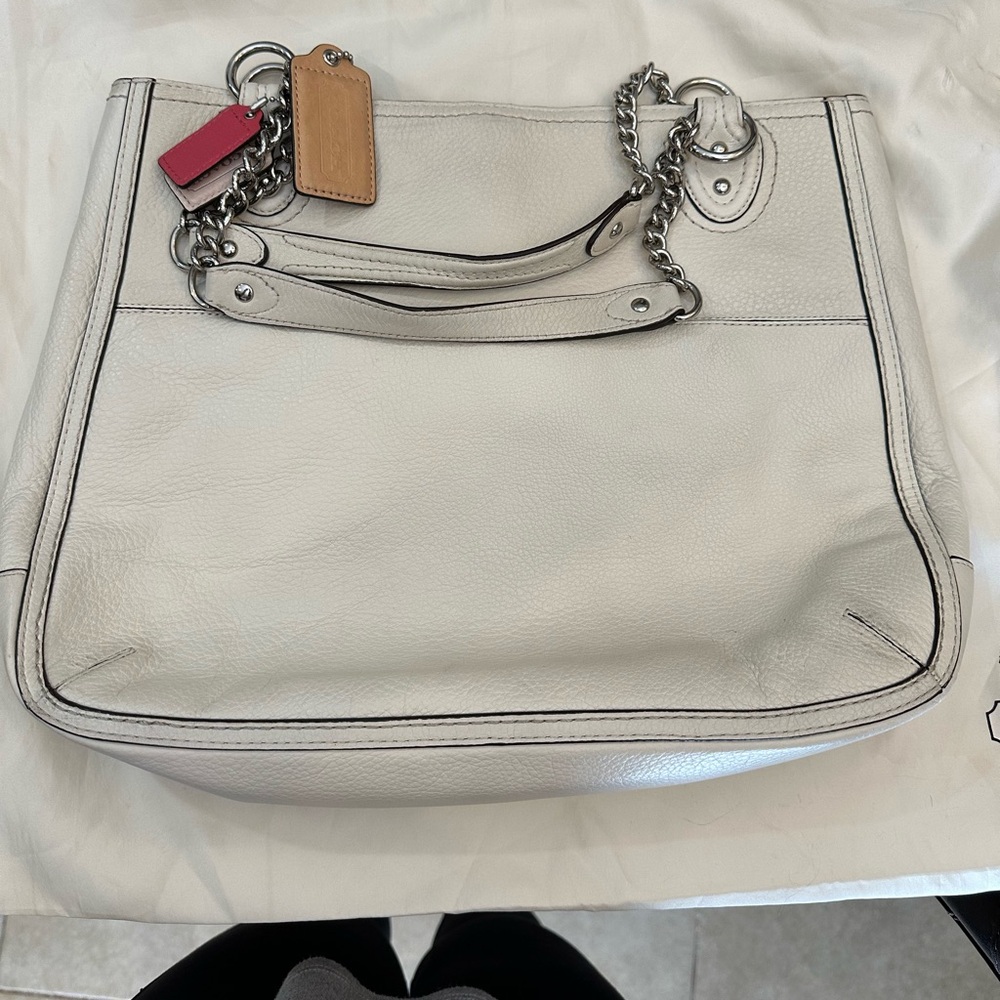 White mid size authentic coach purse some wear on the bottom